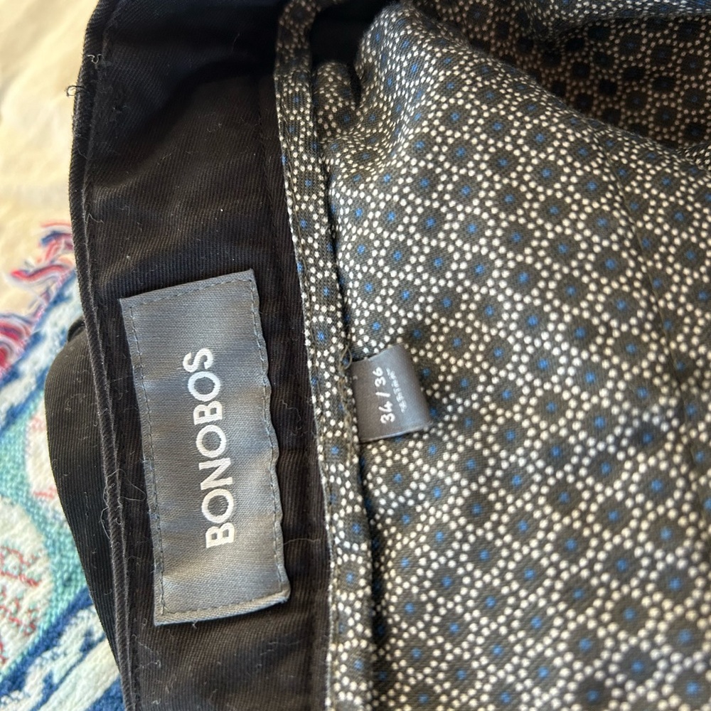 Men’s black straight leg pants made by Bonobos